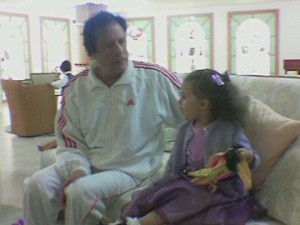 Muammar Gaddafi and his grandchild