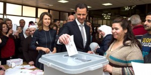 Bashar Assad and Asma al-Assad taking part in Syrian elections