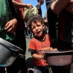 Child at Gaza aid site