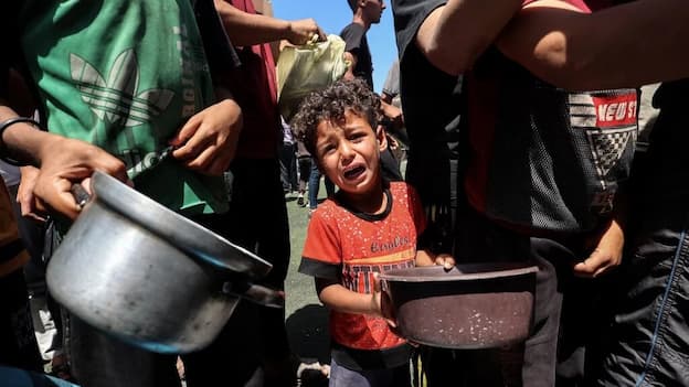 Child at Gaza aid site